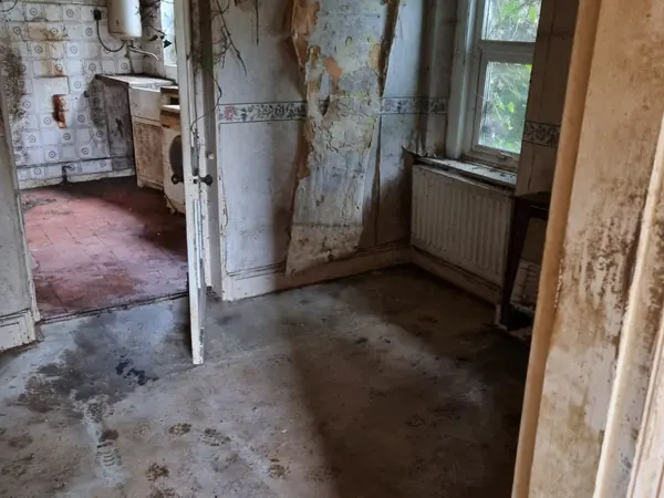 The same hallway cleared back to bare floor