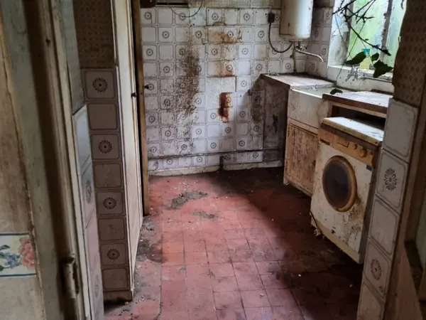 The same hallway cleared back to bare floor