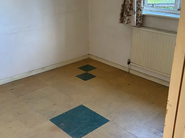 The same garage and garden cleared