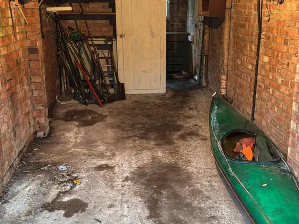 The same garage and garden cleared