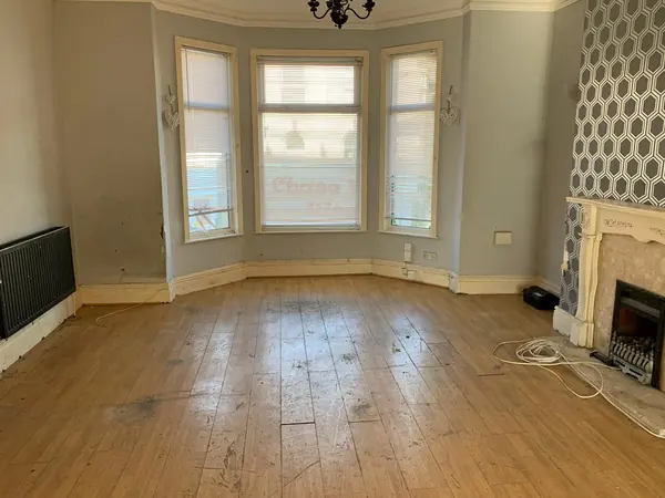 The same house emptied room by room