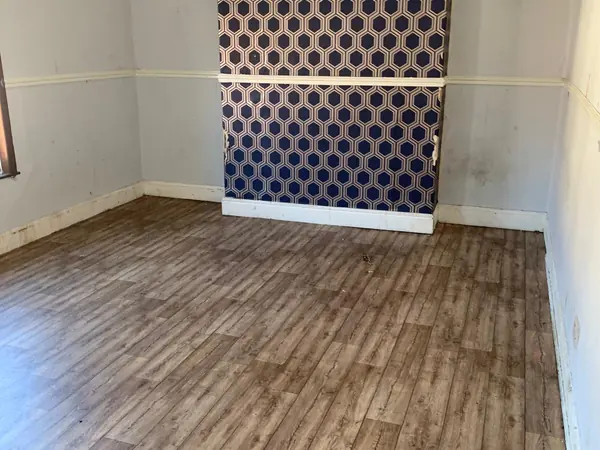 The same house emptied room by room