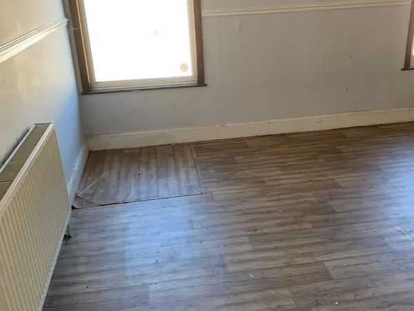 The same house emptied room by room