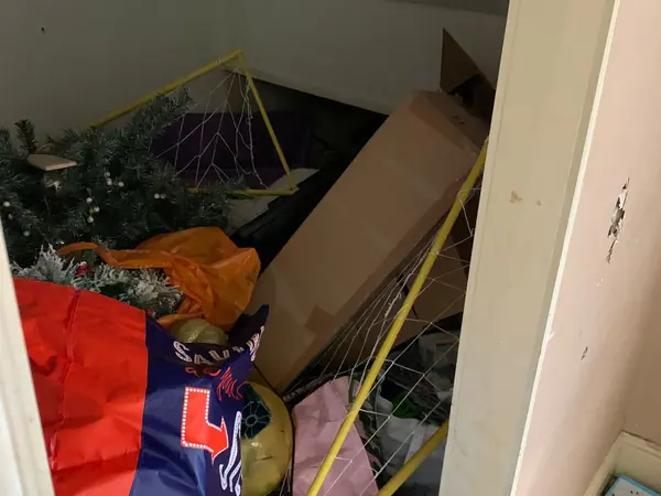 Cluttered house before clearance