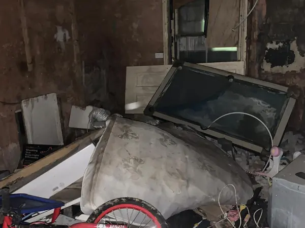 Cluttered house before clearance