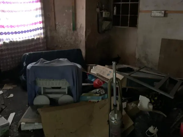 Cluttered house before clearance
