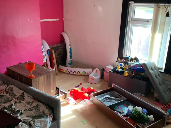 Cluttered house before clearance