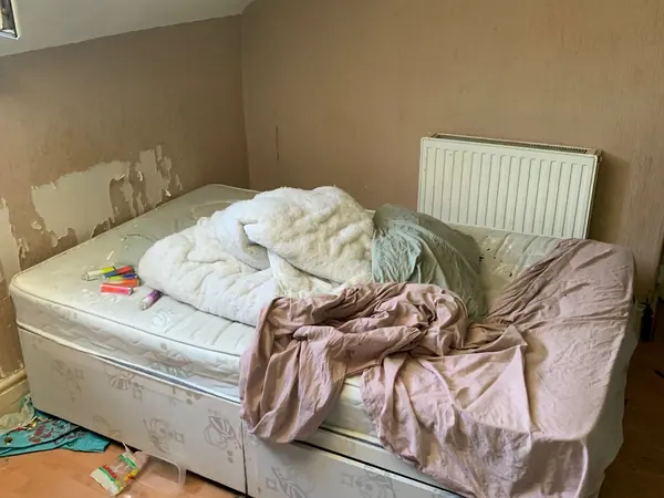 Cluttered house before clearance