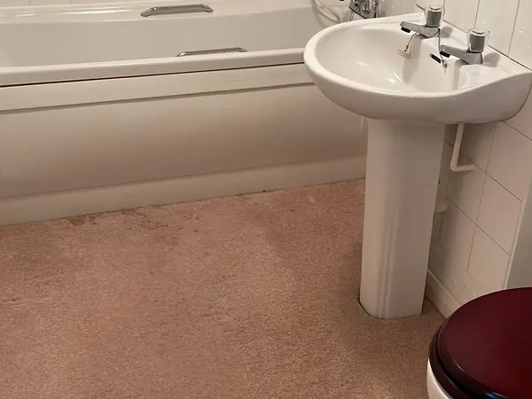The same rooms emptied and the carpets swept