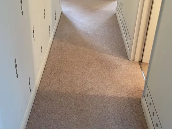 The same rooms emptied and the carpets swept