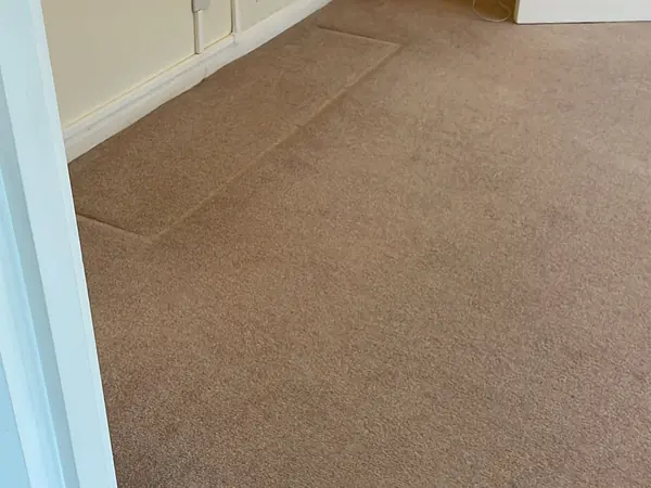 The same rooms emptied and the carpets swept