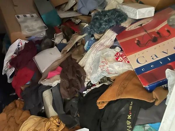 Cottage packed with bags and boxes before clearance